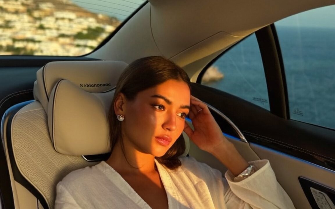 Guest relaxing in the rear lounge seat of a Mercedes-Maybach S-Class