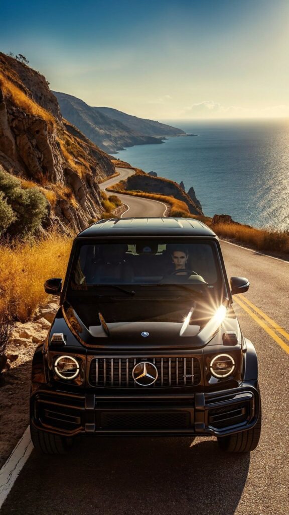 Black Mercedes-Benz G-Class on a coastal road in Mykonos