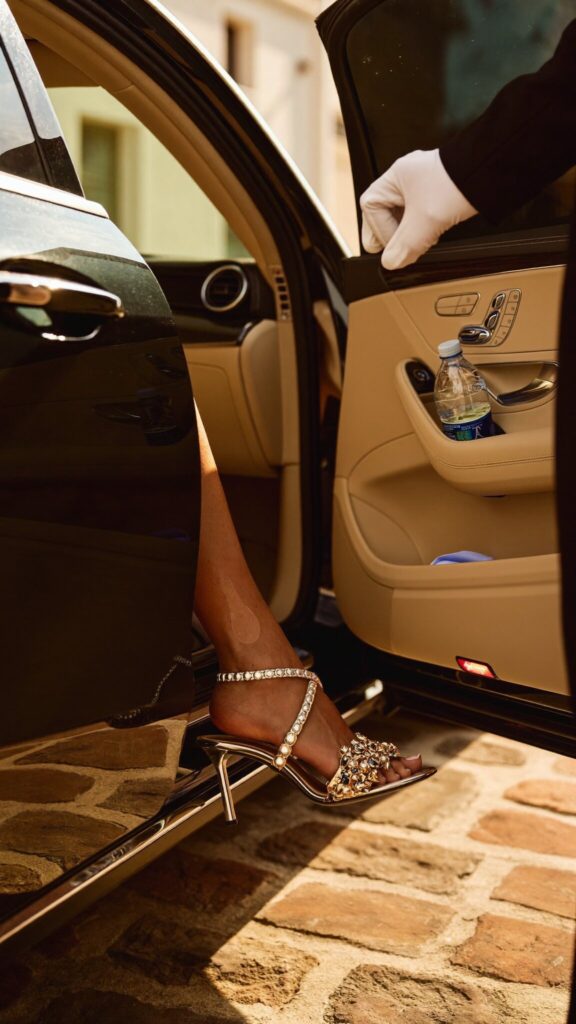 Chauffeur opening the rear door for a guest